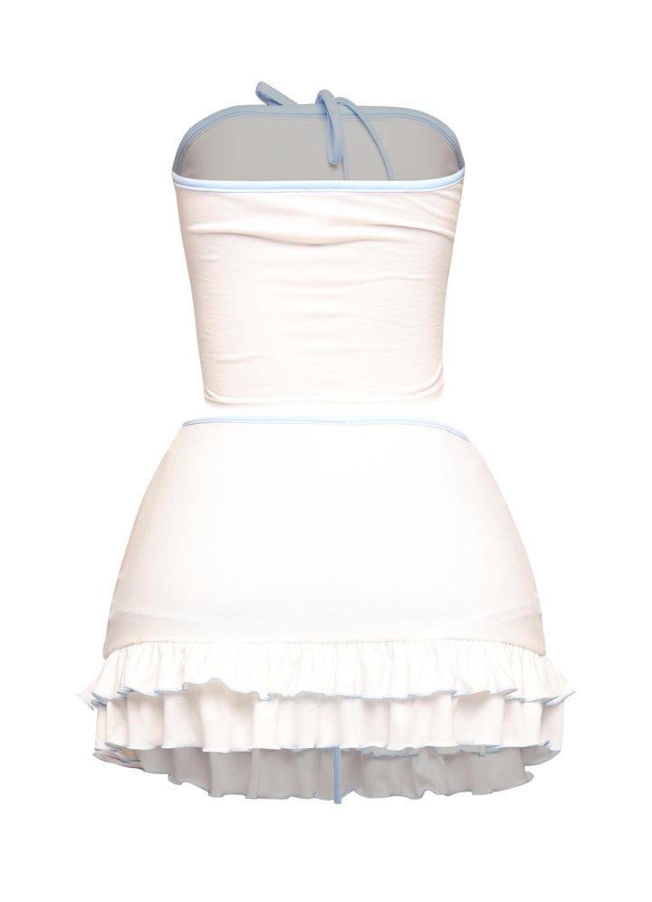 White two-piece with powder blue contrast edges, soft stretch fabric, and midrise skirt with girly ruffles