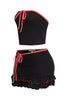 Trendy two-piece black outfit with vibrant pink accents, relaxed fit, and layered ruffle mini skirt