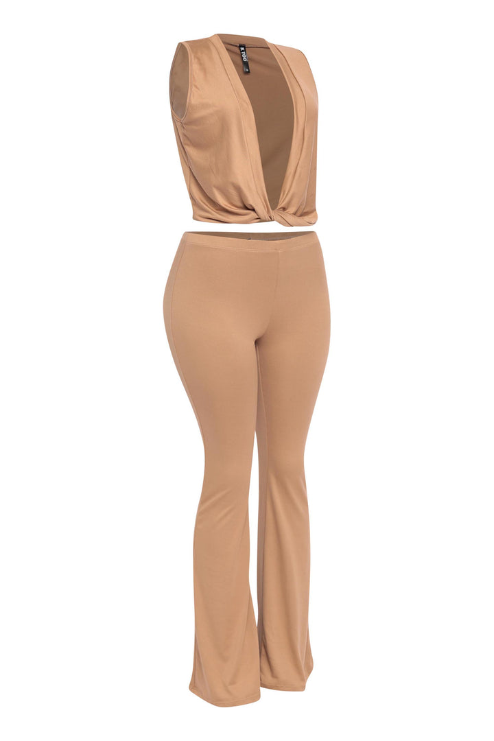 Tan sleeveless two-piece set with plunge front and fitted pull-on pants