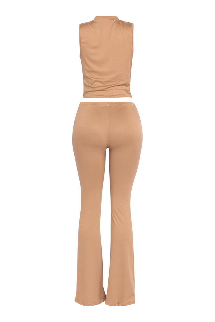 Classic camel-toned outfit featuring deep V crop top and curve-hugging bottoms