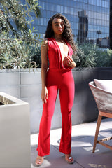 • Red matching set with sleeveless crop top and flare pants in bold statement color
