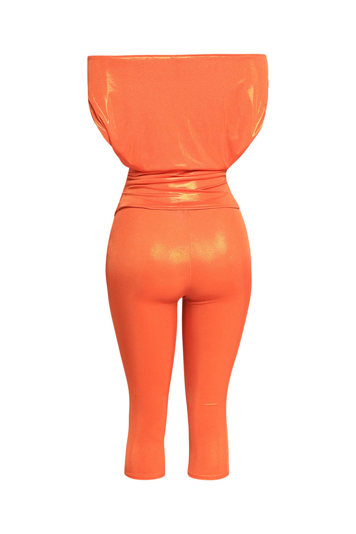 Neon-inspired tangerine party set in glossy fabric with bold silhouette