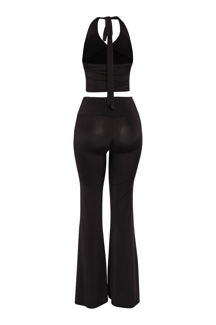 Black halter crop top and flare pants set with waist shaping trim