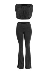 Front view of washed black bubble crop top and flare pants co-ord set