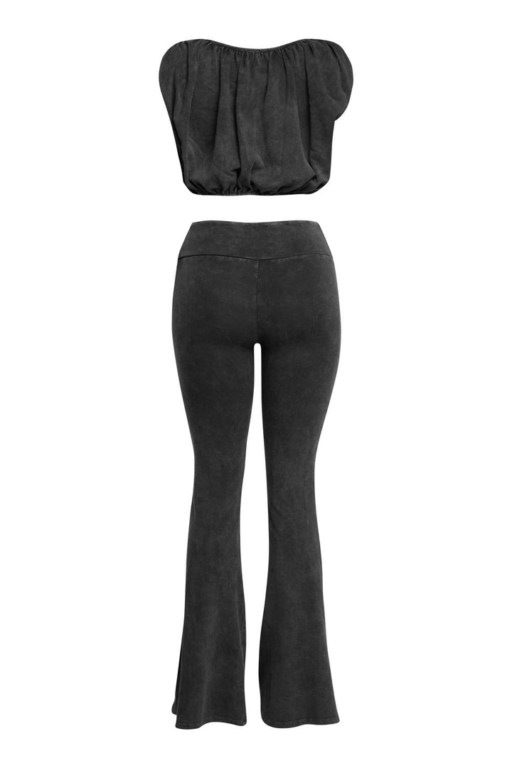 Back view of washed black co-ord with slim-fit flares and scoop back bubble top