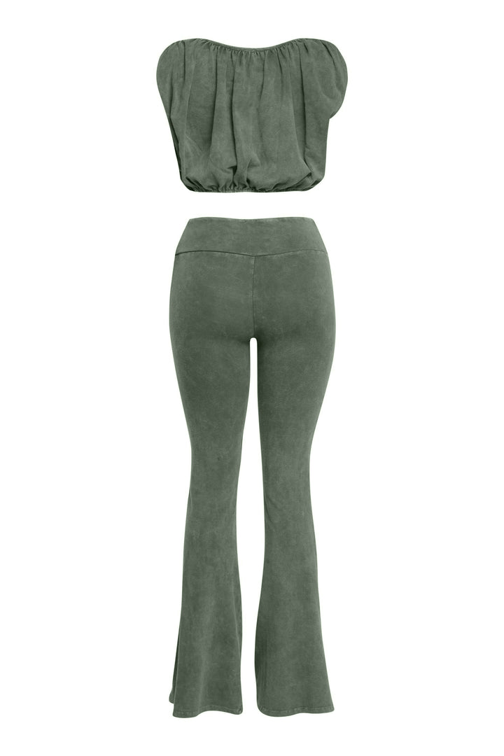 Back view of olive green cotton two-piece with curved seam flares and crop top