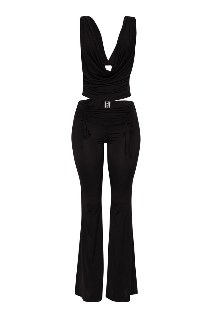 Black cowl neck top and flared pant set with open back and luxe stretch