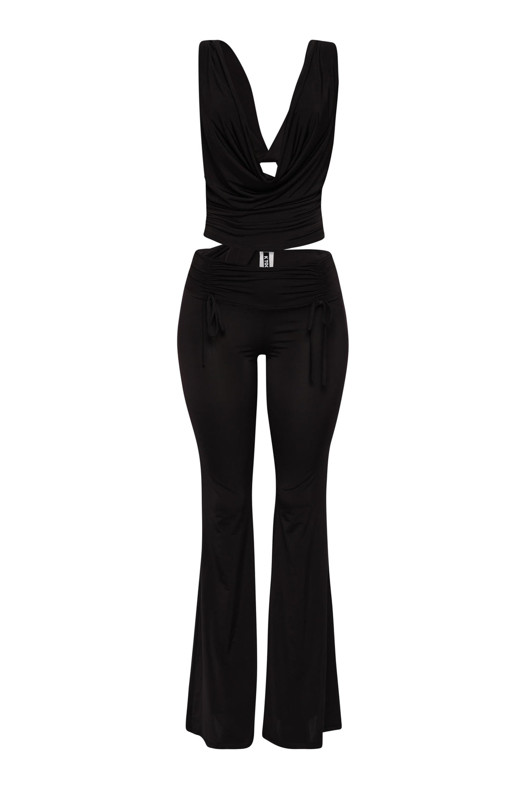 Black cowl neck top and flared pant set with open back and luxe stretch