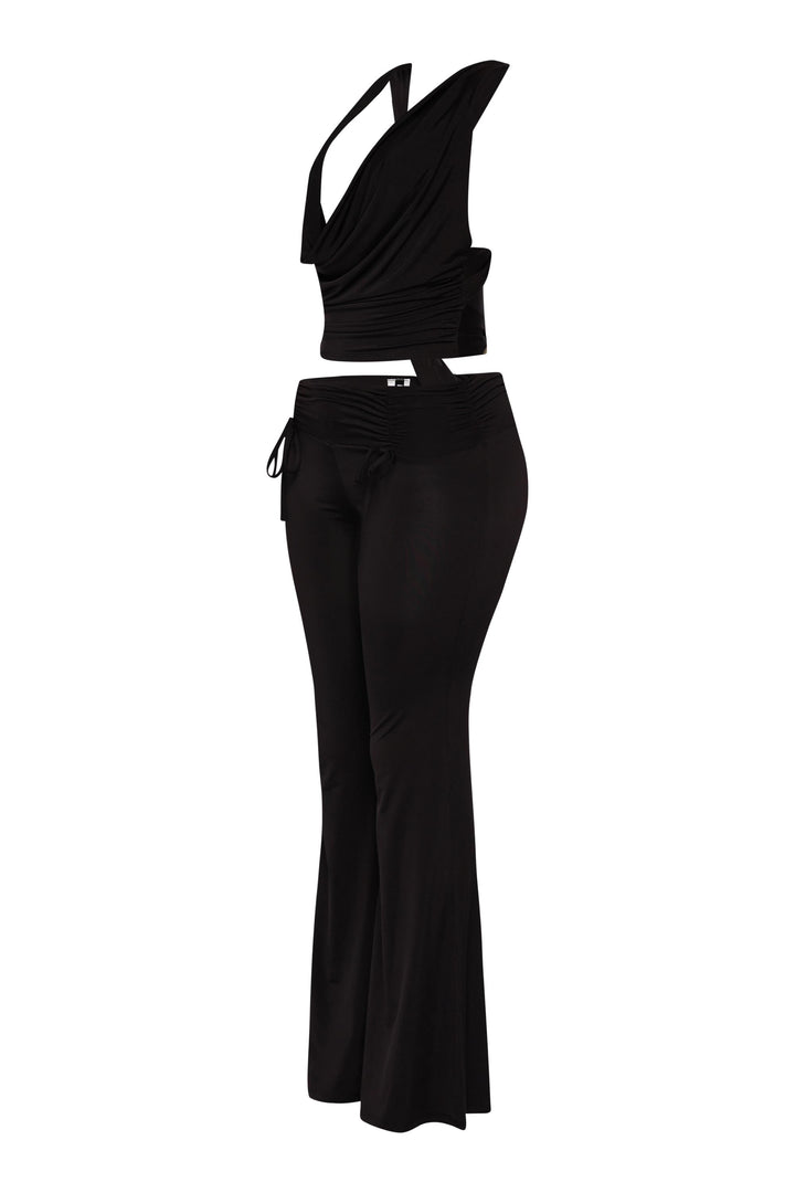 Black flare pant outfit with deep drape front and curve-hugging shape