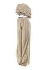 Earth-toned sage outfit with high waist pants and tube top

