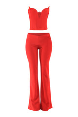Red wired corset top and matching flared pants front view with bold fitted silhouette