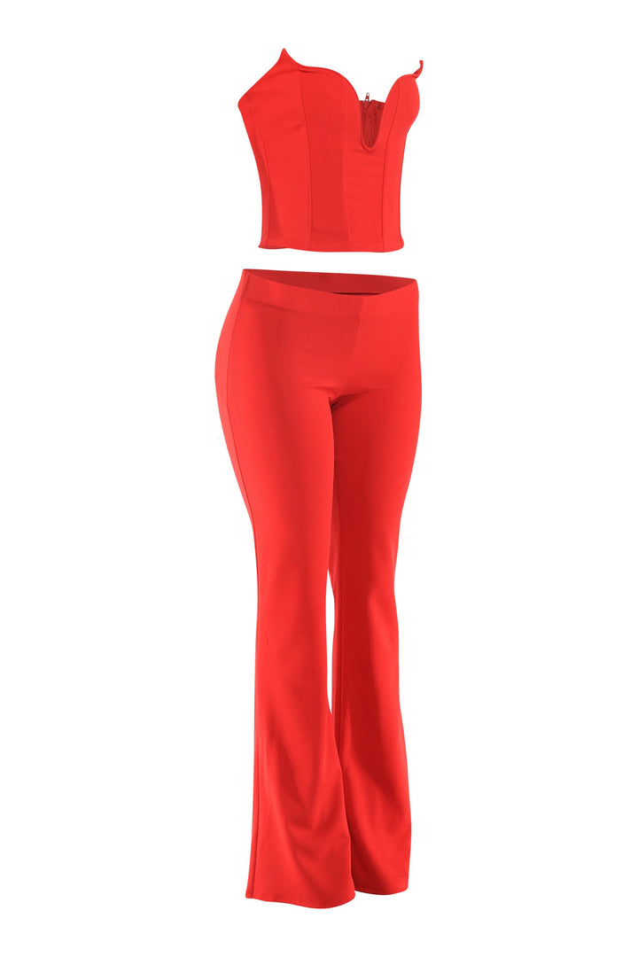 Red flare pant set left quarter angle showing V-notch corset and waist-defining fit