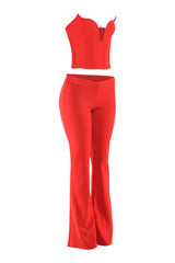Red flare pant set left quarter angle showing V-notch corset and waist-defining fit