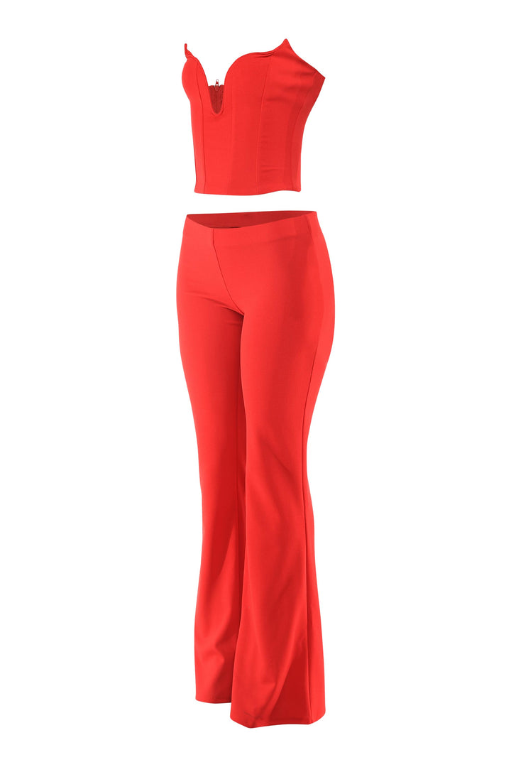 Red outfit with a top and flared pants on a white background