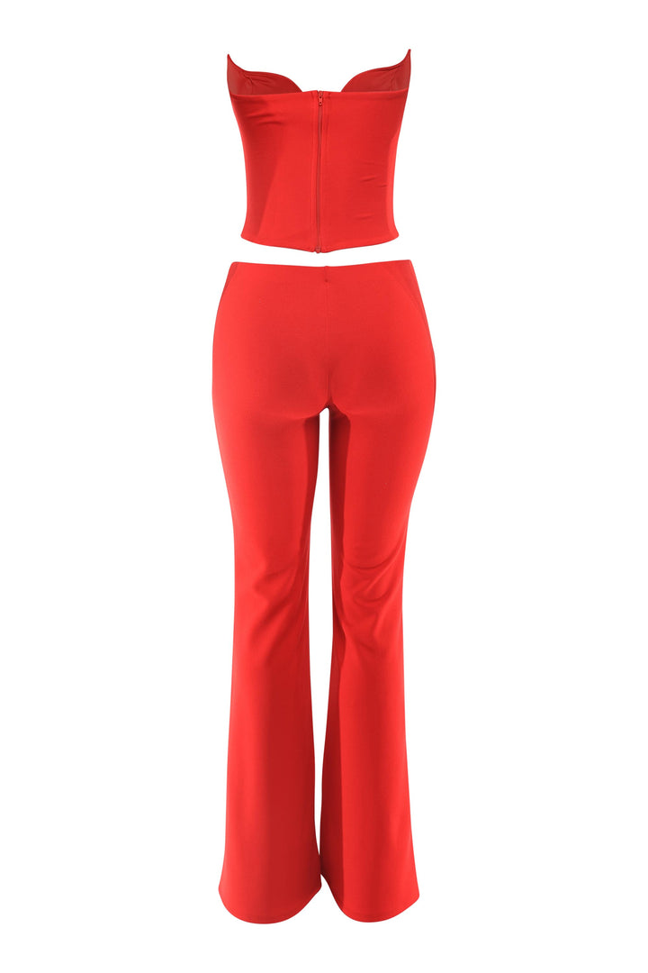 Red corset and flare pant set back view with exposed zipper and sleek tailored finish