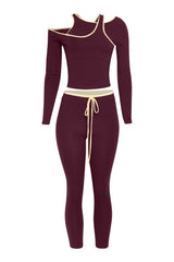 Front view of wine red cutout crop set with cream trim and long sleeve top