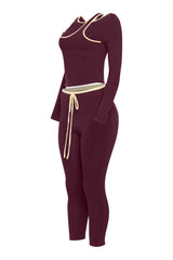 Left angle of wine bodycon set with contrast piping and cold shoulder neckline