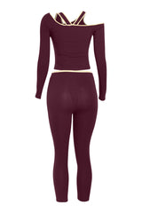 Back view of burgundy slim-fit crop set with crisscross back strap detail