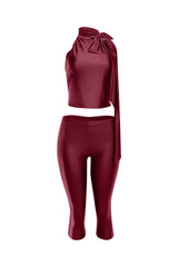 Front view of satin burgundy two-piece set with mock-neck sleeveless top and slim-fit cropped pants