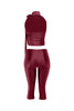 Back view of burgundy crop top with open back and elastic waist satin pants