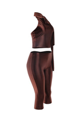 Left angle of brown two-piece outfit with tie-neck detail and figure-skimming pants