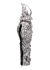 Monochrome tie-dye festival outfit with dramatic fringe and bold ruffle details

