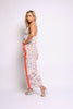 Model in boho-inspired swirl print set with fringe and body-hugging fit

