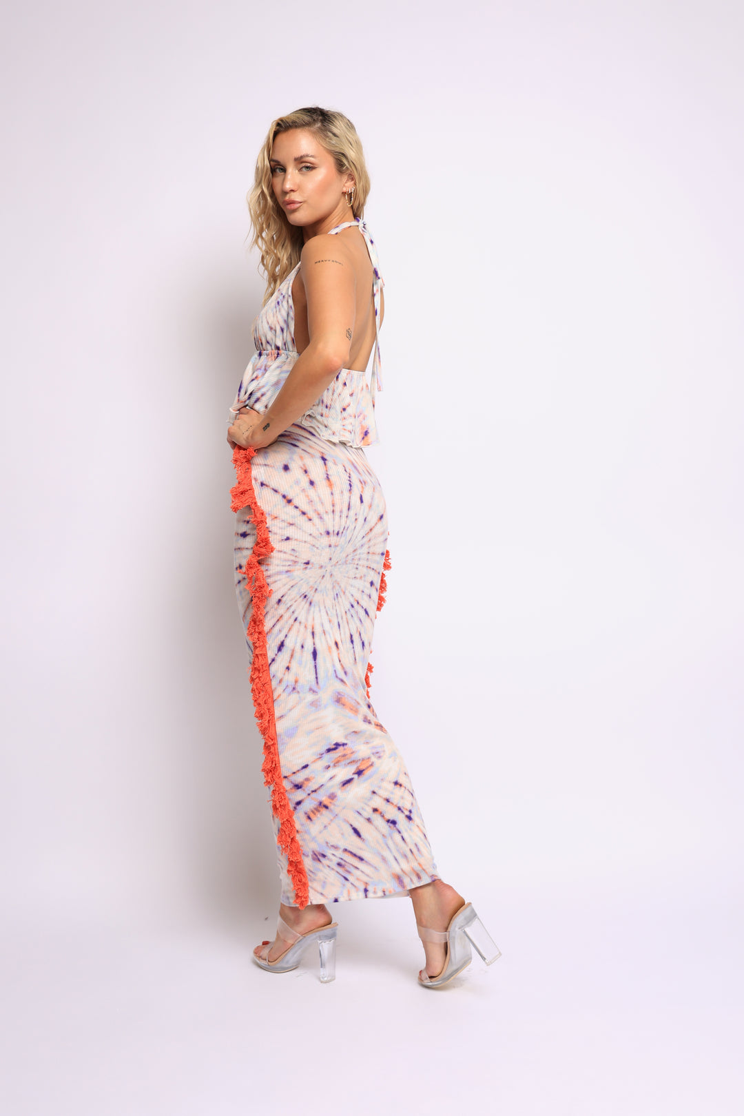 Model in boho-inspired swirl print set with fringe and body-hugging fit

