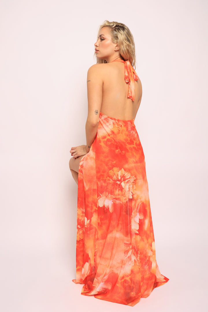 • Sitting pose in orange skirt set showing stretch fabric and layered silhouette


