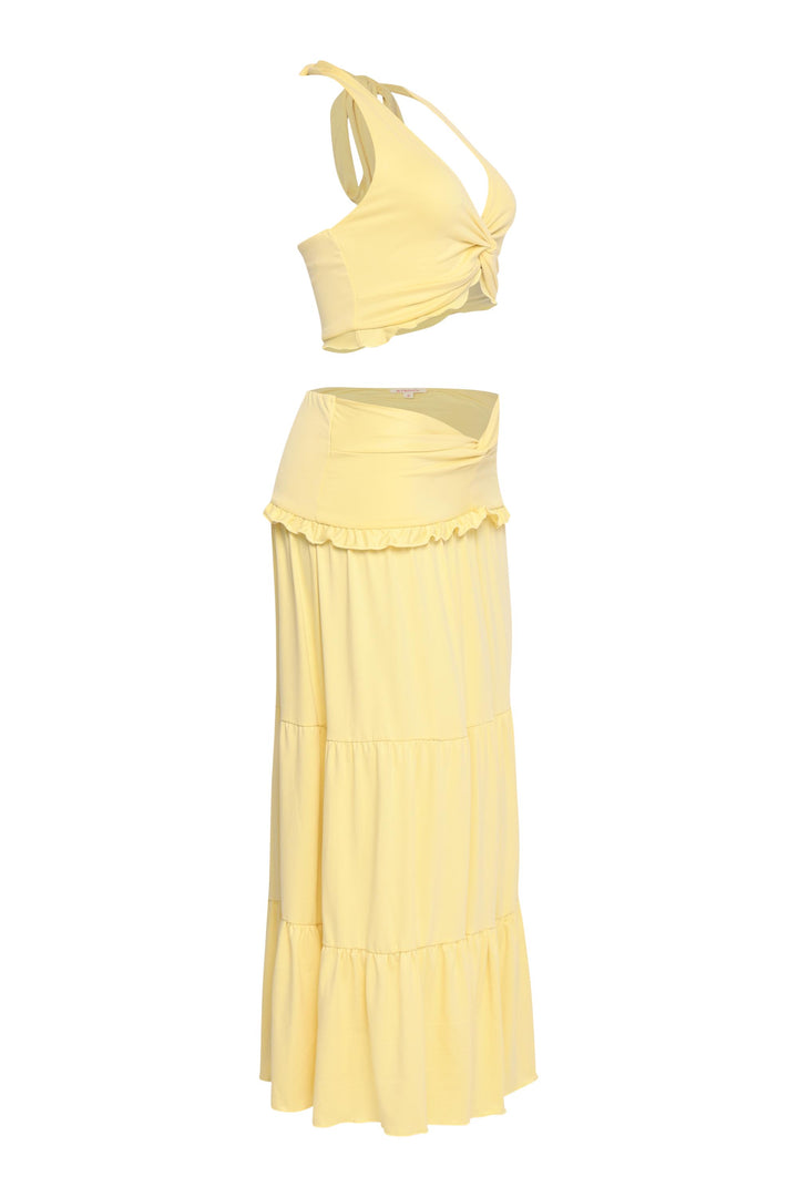 Yellow maxi skirt and crop top set with feminine silhouette and flirty charm

