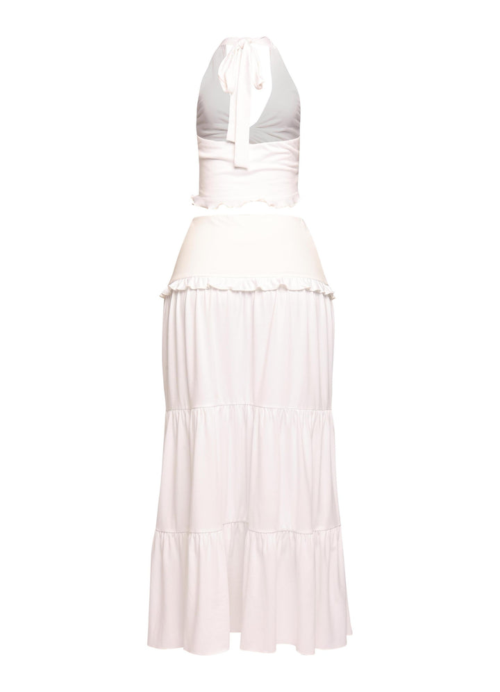Minimalist white co-ord set with flattering V-waist skirt and soft draping


