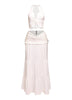 White beach-ready outfit with halter tie-back and merrow hem details

