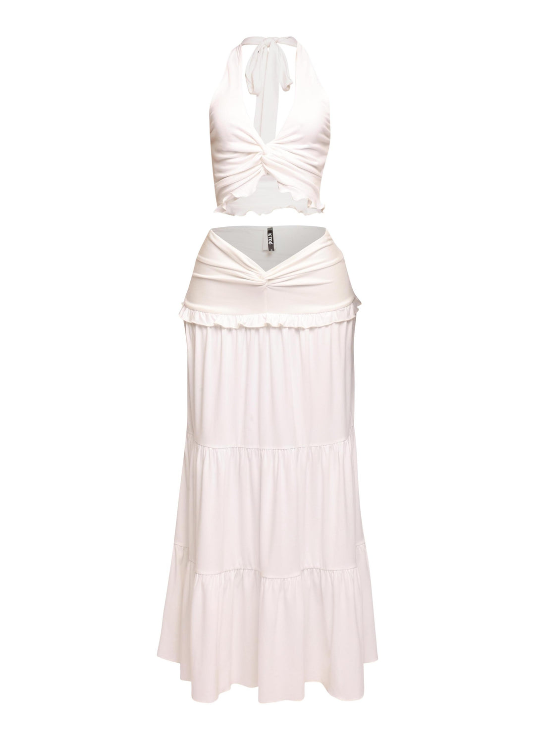 White beach-ready outfit with halter tie-back and merrow hem details

