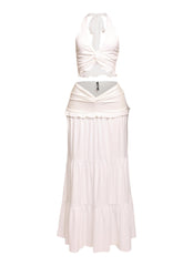 White beach-ready outfit with halter tie-back and merrow hem details

