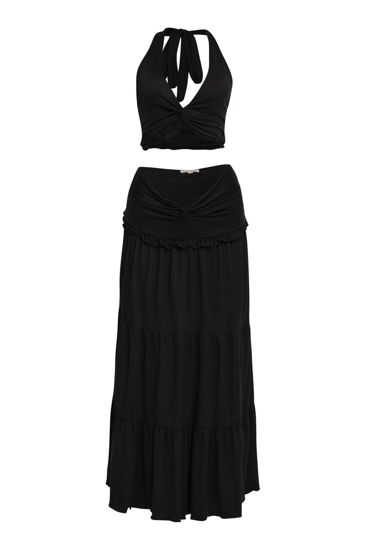 Sleek black co-ord skirt set with flirty twist detail and curve-hugging fit

