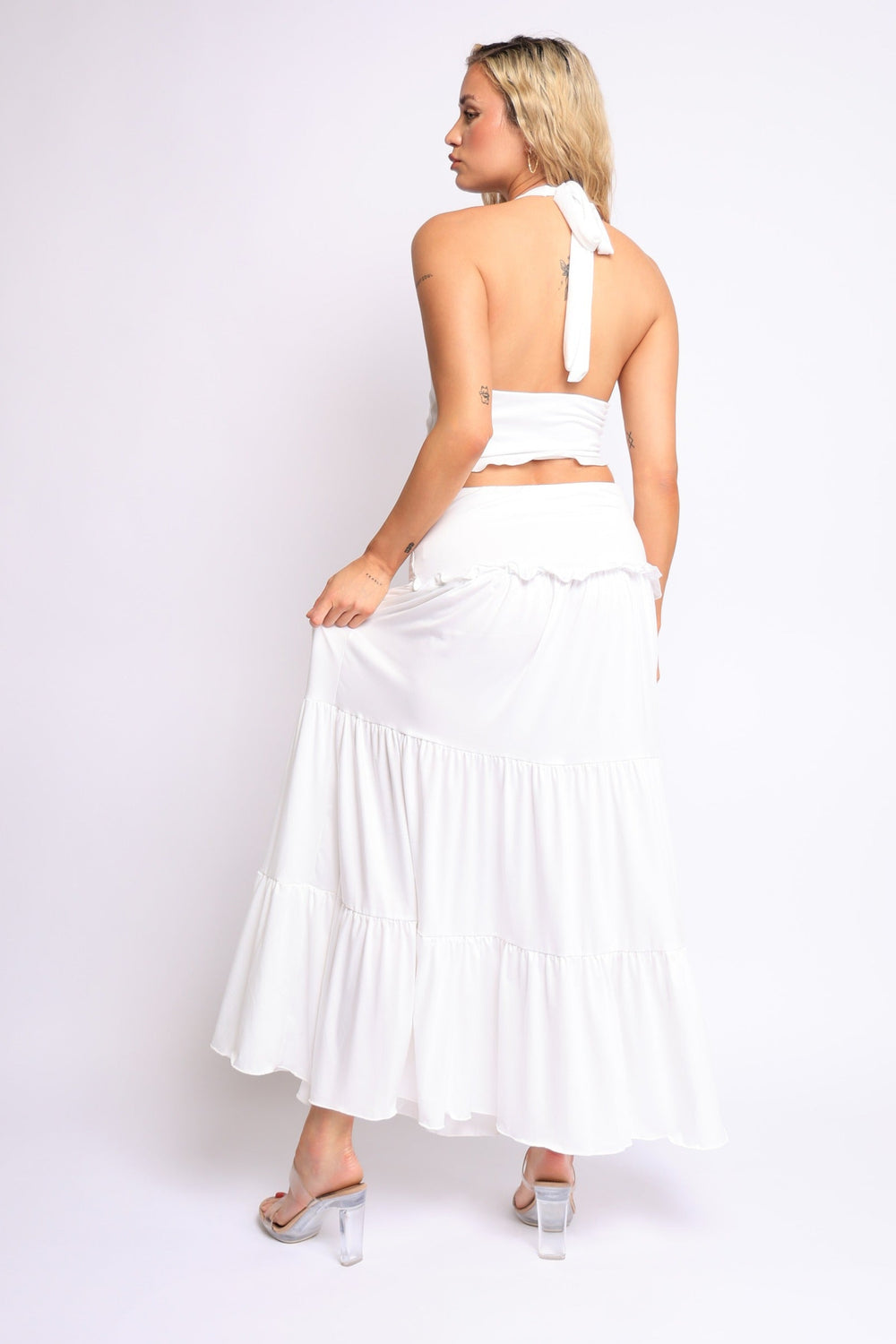 Summer white two-piece set with plunging neckline and flowy maxi skirt

