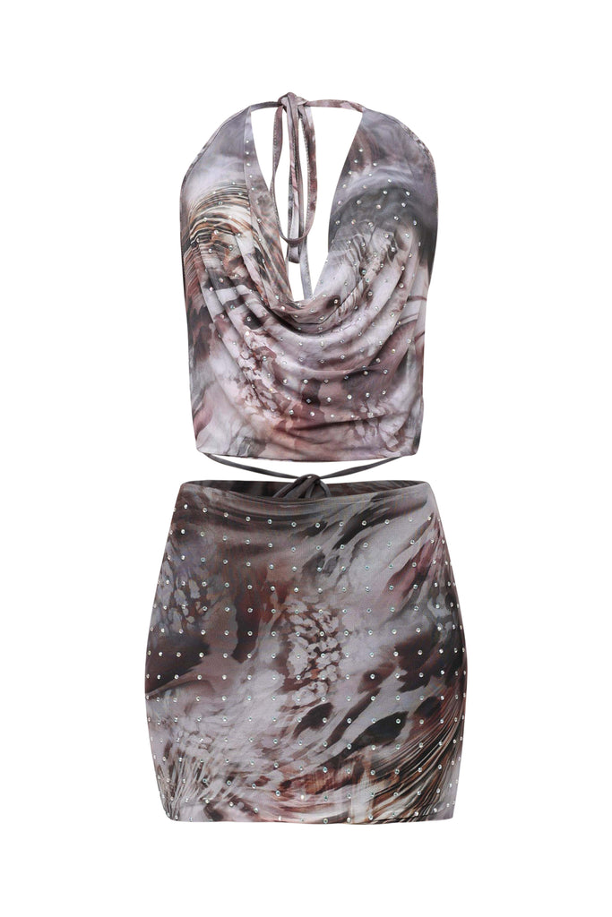 Two-piece outfit with a patterned top and skirt on a white background