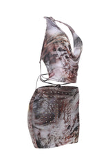 Marbled patterned dress with a halter neck design on a white background