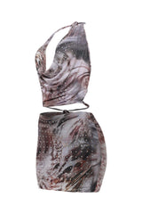 Two-piece outfit with marbled pattern on a white background