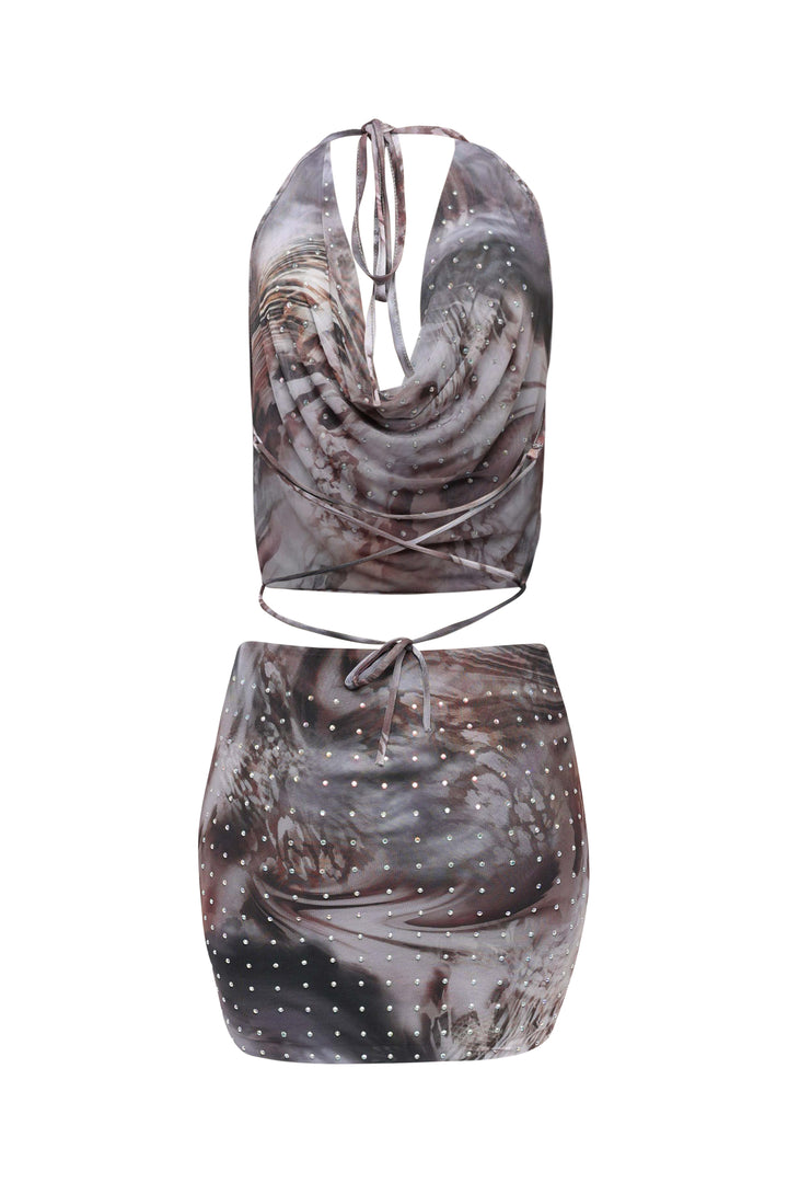 Two-piece outfit with a patterned top and skirt on a white background