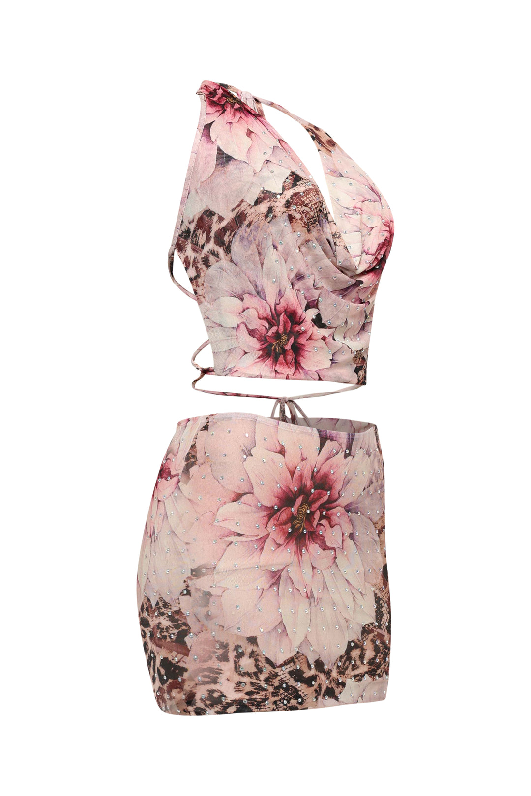 Side view of pink floral mesh crop set with cowl neckline and printed mini skirt
