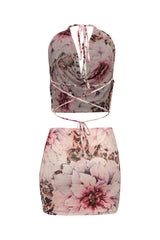 Back view of pink mesh skirt set with open tie back and bold floral placement print