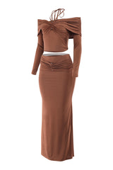 Brown two-piece outfit with long sleeves and a fitted skirt on a white background