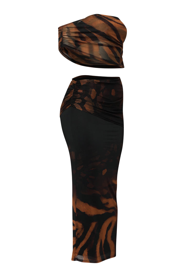 Black and brown patterned headscarf and skirt set on a white background