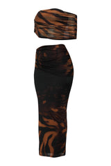 Black and brown patterned top and skirt set on a white background