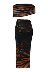 Zebra print headband and skirt set on a white background