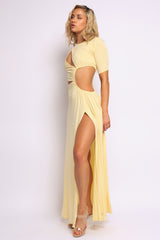 Playful yellow maxi with front slit and side waist cutouts in soft jersey knit

