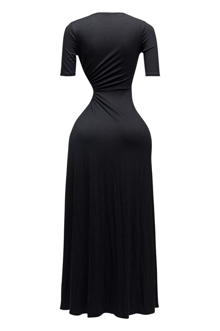 Sultry black cutout dress with curve-hugging fit and thigh-high leg slit


