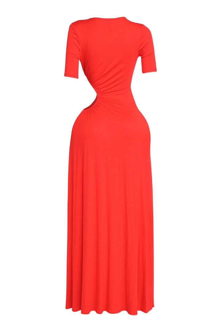 Chic red dress with cutout waist, gathered center detail, and elongated hem

