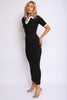 Black maxi dress with white collar and sleeve trim, fitted and structured, front-facing

